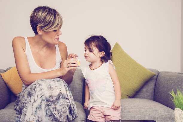 istock Mother taking care of her daughter 975743536