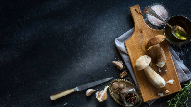 istock fresh forest mushroom;  Italian cooking recipes background 975747890
