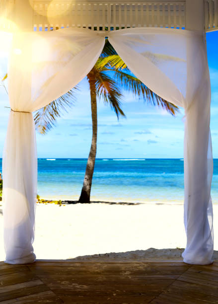 Art Beautiful sunrise over the tropical beach; wedding ceremony marquee.