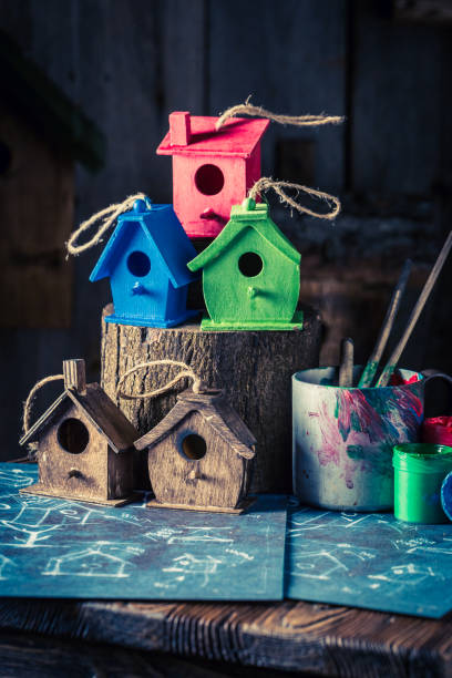 istock Small and cute bird feeder and blue construction plan 975748790
