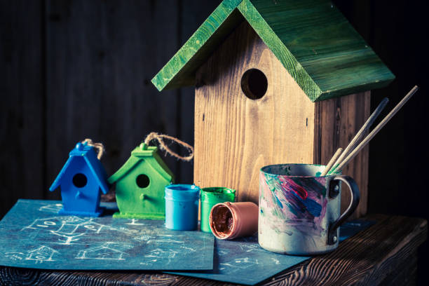 istock Wooden bird feeder and blue plan to build it 975749838