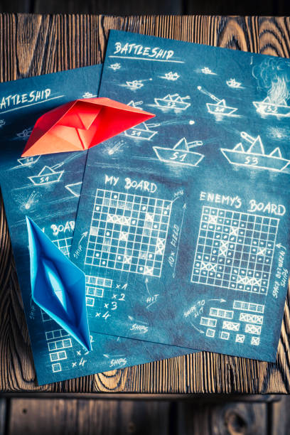istock Battleship paper game ready to play and red ship 975751730