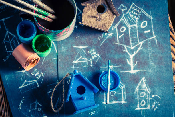 istock Vintage home for birds and blue construction scheme 975753464