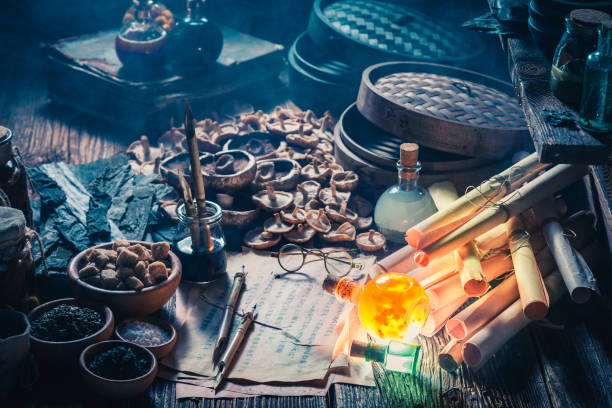 istock Vintage scrolls and recipe in old alchemist laboratory 975754730