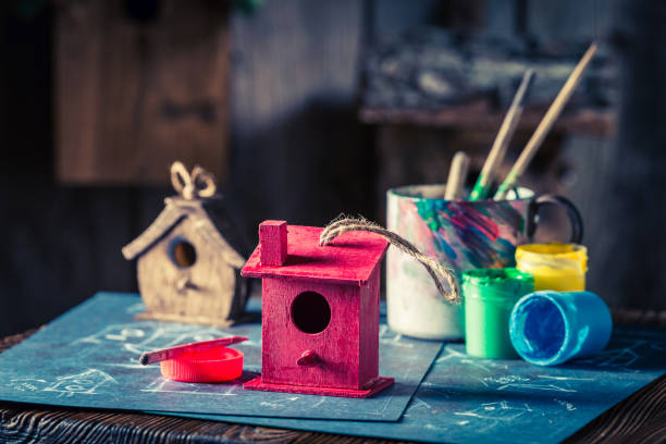 istock Project of small home for birds in wooden workshop 975755720