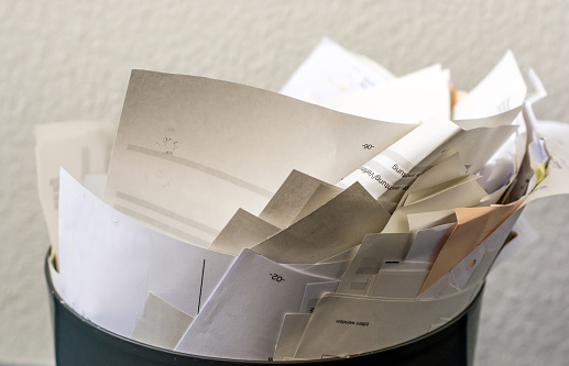 Overcrowded trash in an office