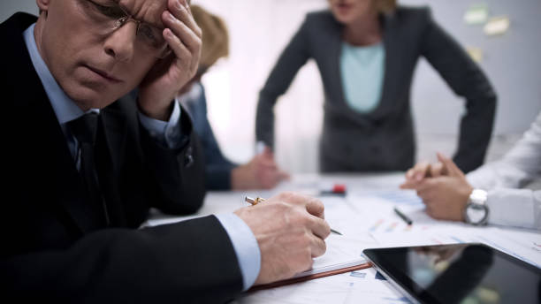istock Tired office worker feeling scared, suffering at meeting with terror lady boss 975777356