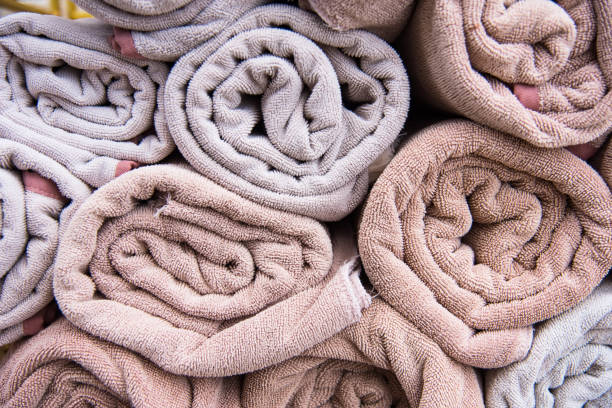 istock Beach bath towel rolls blue fabric texture cloth background used for swimming pool. 975783146