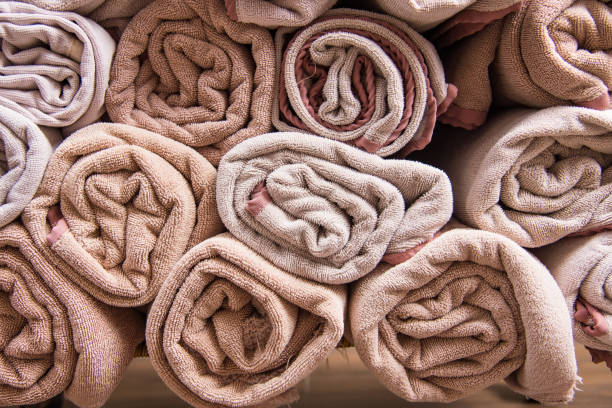 istock Beach bath towel rolls blue fabric texture cloth background used for swimming pool. 975783182