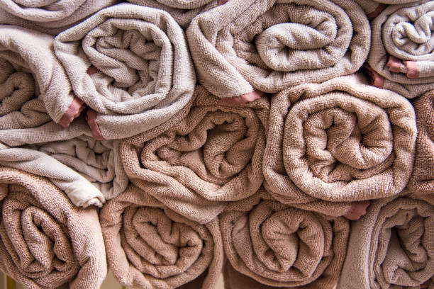 istock Beach bath towel rolls blue fabric texture cloth background used for swimming pool. 975783226