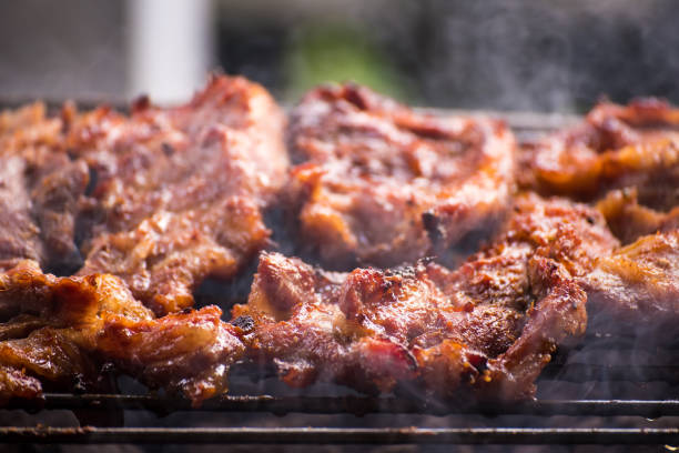 istock Grilled pork cutlets,on a charcoal grill. 975783732