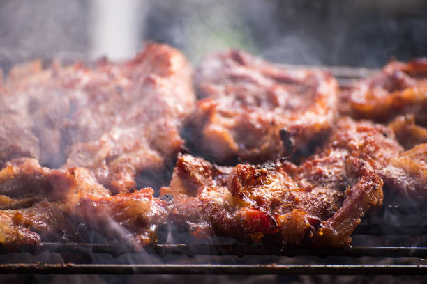 istock Grilled pork cutlets,on a charcoal grill. 975783800