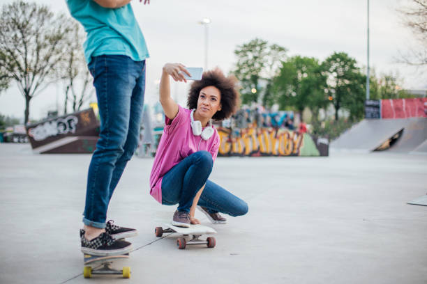 istock Woman taking a selfie on the skateboard 975790746