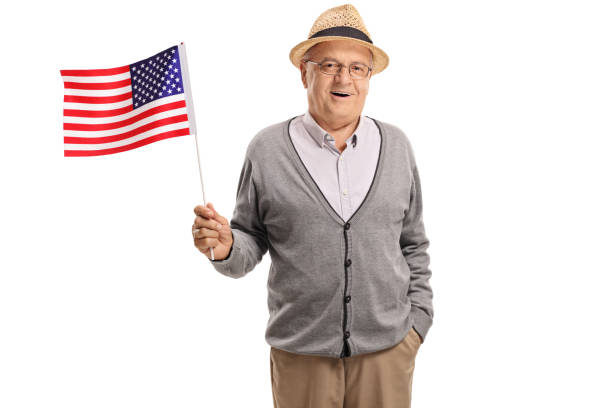istock Mature man holding an American flag 975792056