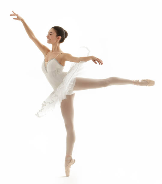 istock ballerina doing a arabesque with a white tutu on white background 975792244