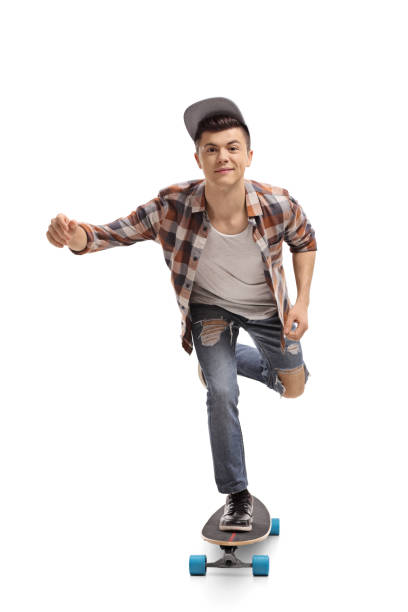 istock Teenage skater riding a longboard 975792444