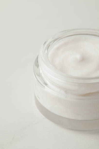 istock close up view of organic cream in container on white surface 975806520