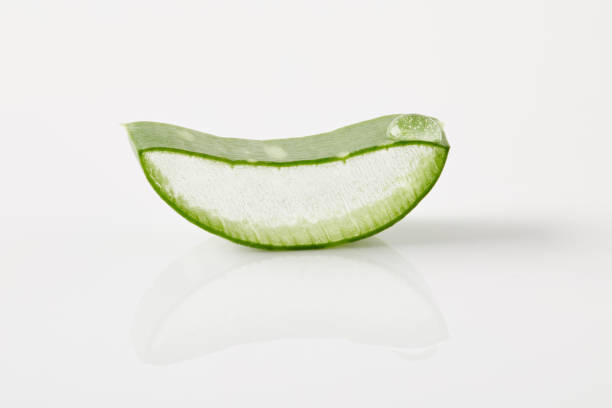 istock closeup shot of aloe vera slice on white surface 975812080