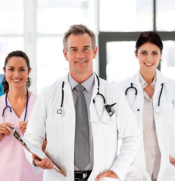 istock Senior Smiling doctor with his colleagues 97581642