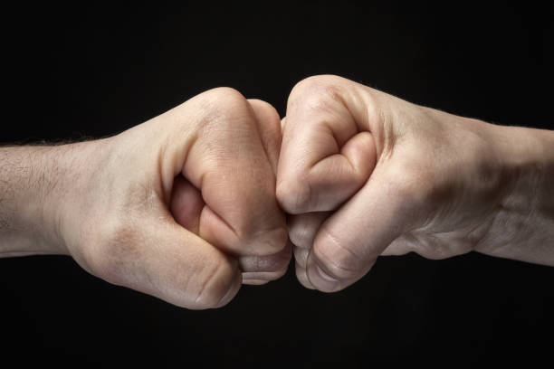 istock clash of two fists 975822412