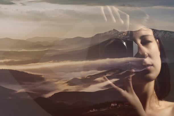 istock Woman with camera on mountain landscape background. 975823130