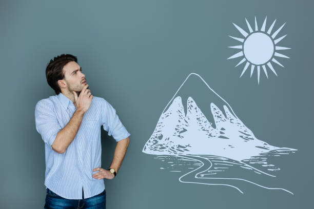 istock Young tourist feeling curious while looking at the high mountain 975836146