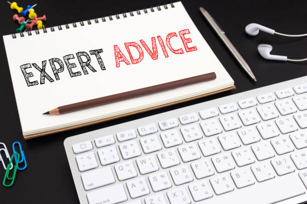 istock Word text Expert advice on white paper on office table / business concept 975848066