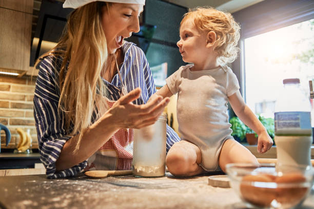 istock mother and her baby having fun cooking together 975859520