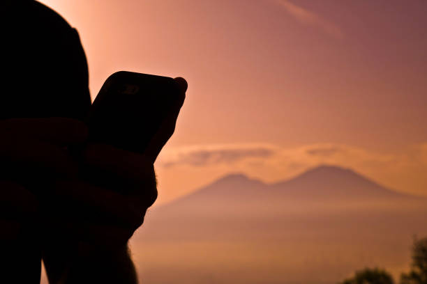 istock Panorama of Naples with man making a selfie 975865486