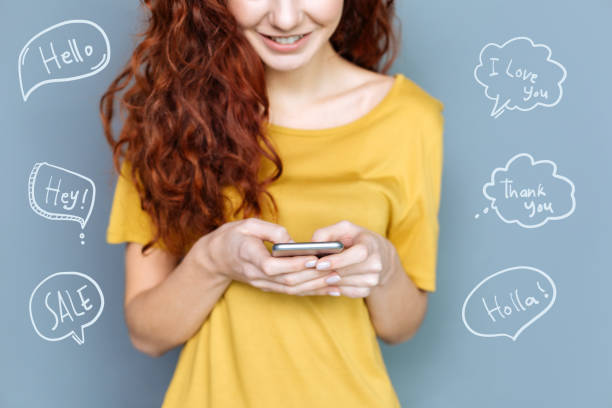 istock Modern woman typing messages and smiling 975866192