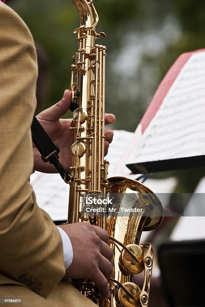 Saxophone Concert The jazz musician plays on a saxophone Big Band Stock Photo