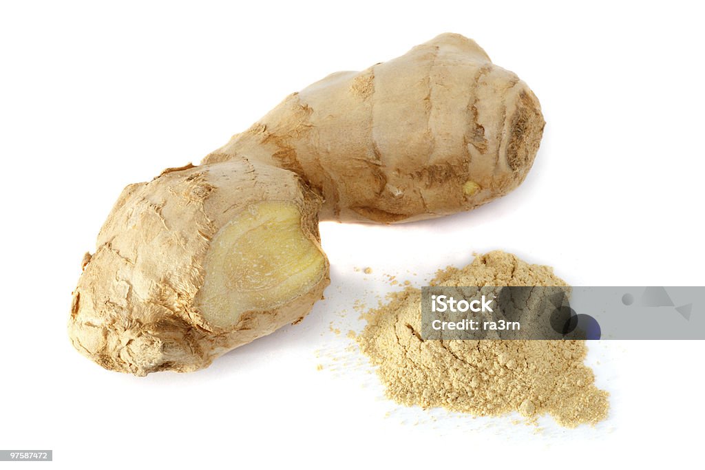 Ginger in root and powder form Spices closeup. The root and ginger powder on a white background. Soft shadow Close-up Stock Photo