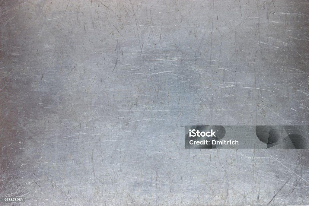 iron texture, pattern the metal plate with scuffed old metal background, bright iron texture, worn brush or sandpaper Metal Stock Photo