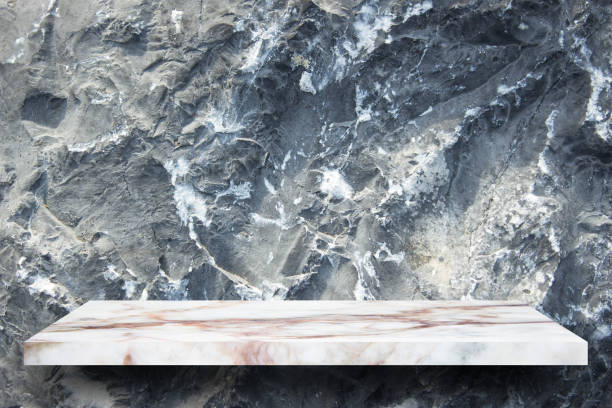 istock Empty top marble shelves and stone wall background / for product display montage product display 975879156