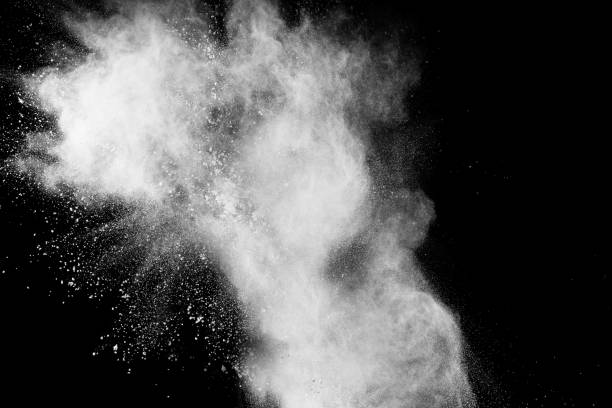 istock Launched white powder splash on black background. Bizarre forms of of white powder explosion cloud against dark background. 975887264