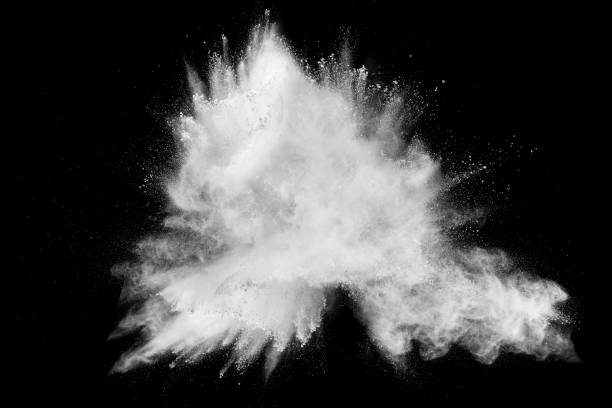 istock Launched white powder splash on black background. Bizarre forms of of white powder explosion cloud against dark background. 975887312