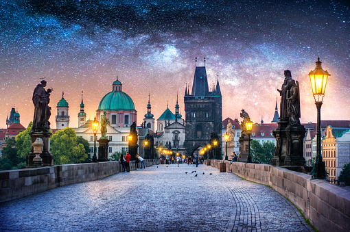 Composition of Charles Bridge in Prague at night with a milky way night sky. Czech Republic