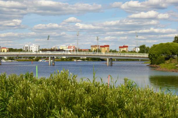 istock Pedestrian bridge across the water on as sunny day 975895444