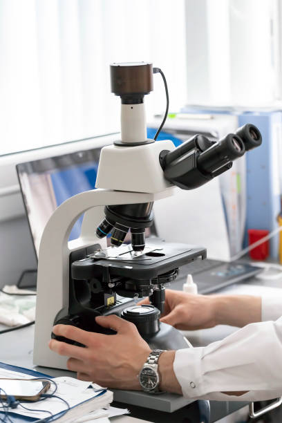 Microscope In Hand 460+ Hand Holding Microscope Slide Stock Photos, Pictures & Royalty ...
