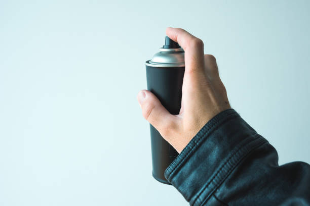 istock Graffiti artist holding color spray can 975902668