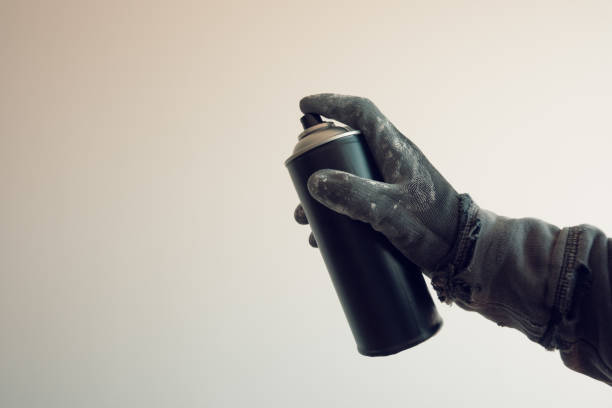 istock Graffiti artist holding color spray can 975903096