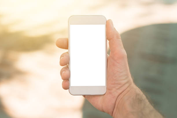istock Smart phone with blank screen in male hand 975904266