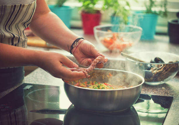 istock Young Woman Cooking at Home 975912830