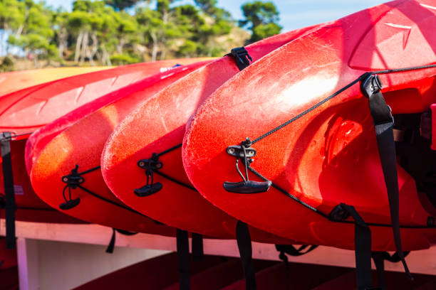 istock Heap of red kayaks on a beach 975922036