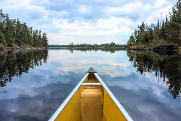 Canoe and lake reflections in Minnesota Lake, Refection, Cloudscape, Sky, boundary waters canoe area stock pictures, royalty-free photos & images