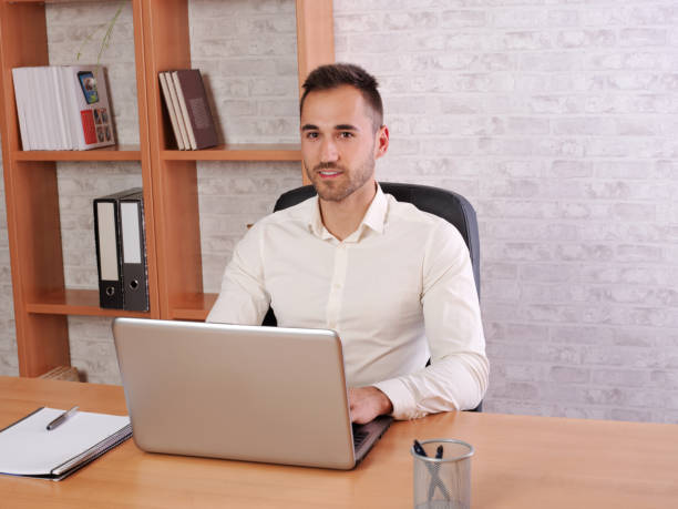 istock Image representing a young man doing work in the office or at home. 975934014