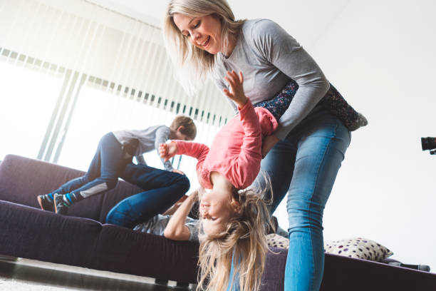 istock Loving parents playing with their children 975962230