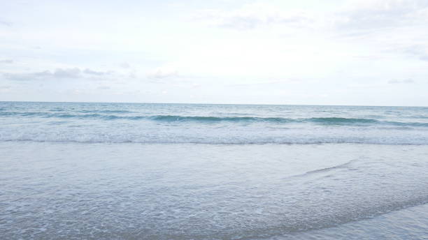 istock Beautiful Sea water soft wave and soft light background. 975963002