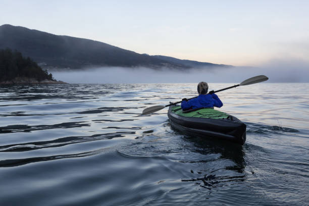 istock Kayaking during a foggy sunset 975963910