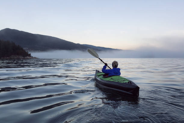 istock Kayaking during a foggy sunset 975964114